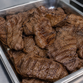Bulk grilled seasoned steak