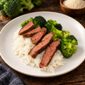 Steak Rice Broccoli with ingredients in the background